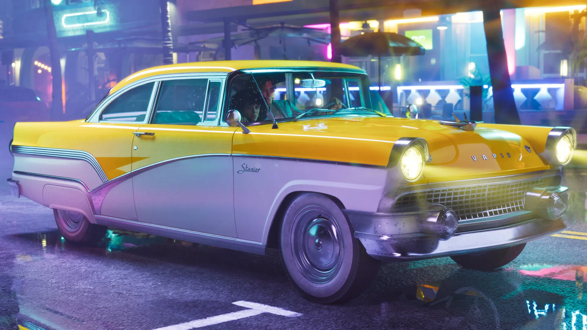 Official Rockstar screenshot of the yellow-and-white '55 Vapid Stanier classic sedan on a neon-lit Vice City street at night, part of the Vintage Vice City Pack